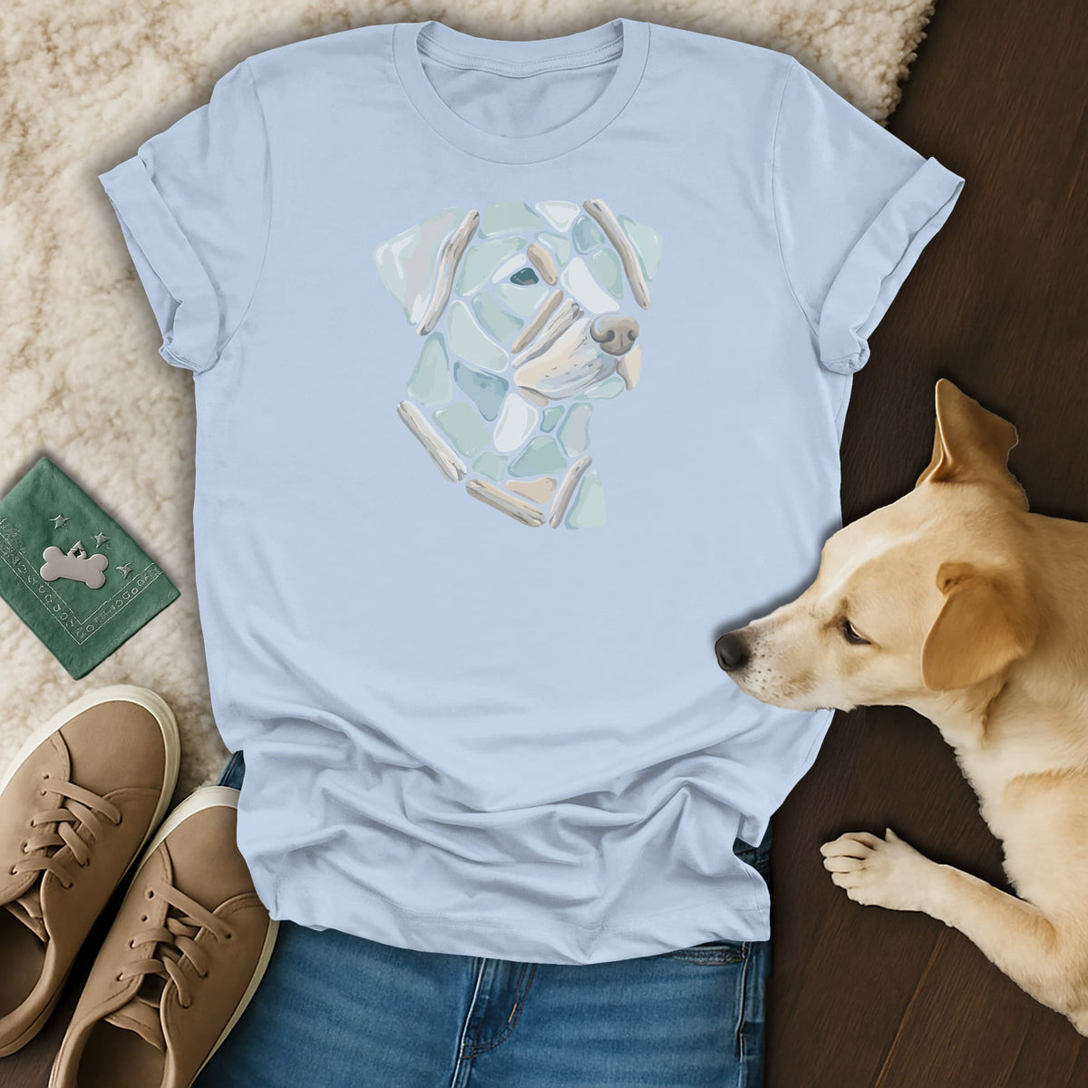Light blue t-shirt with mosaic dog head design and a real dog.