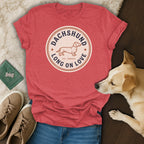 Red t-shirt with dachshund graphic that reads "Dachshund Long On Love".