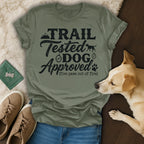 Trail Tested Dog Approved graphic tee with paw print and dog silhouette.