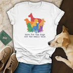 White t-shirt with colorful distressed dog illustrations and text.