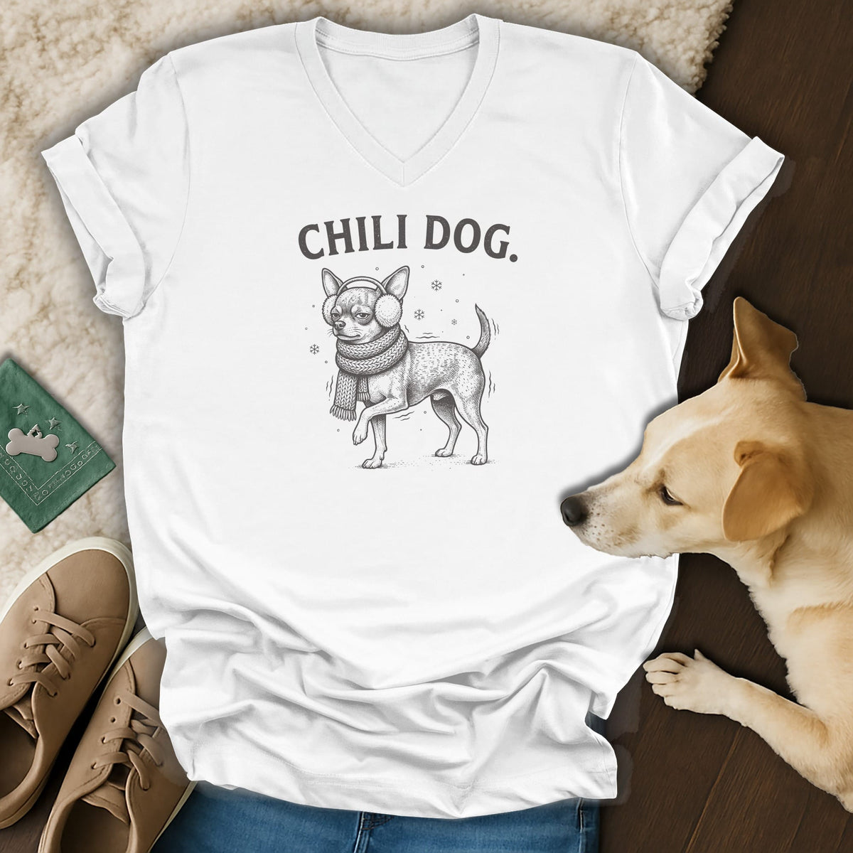 White t-shirt with "CHILI DOG." text and sketch of dog in scarf and earmuffs.