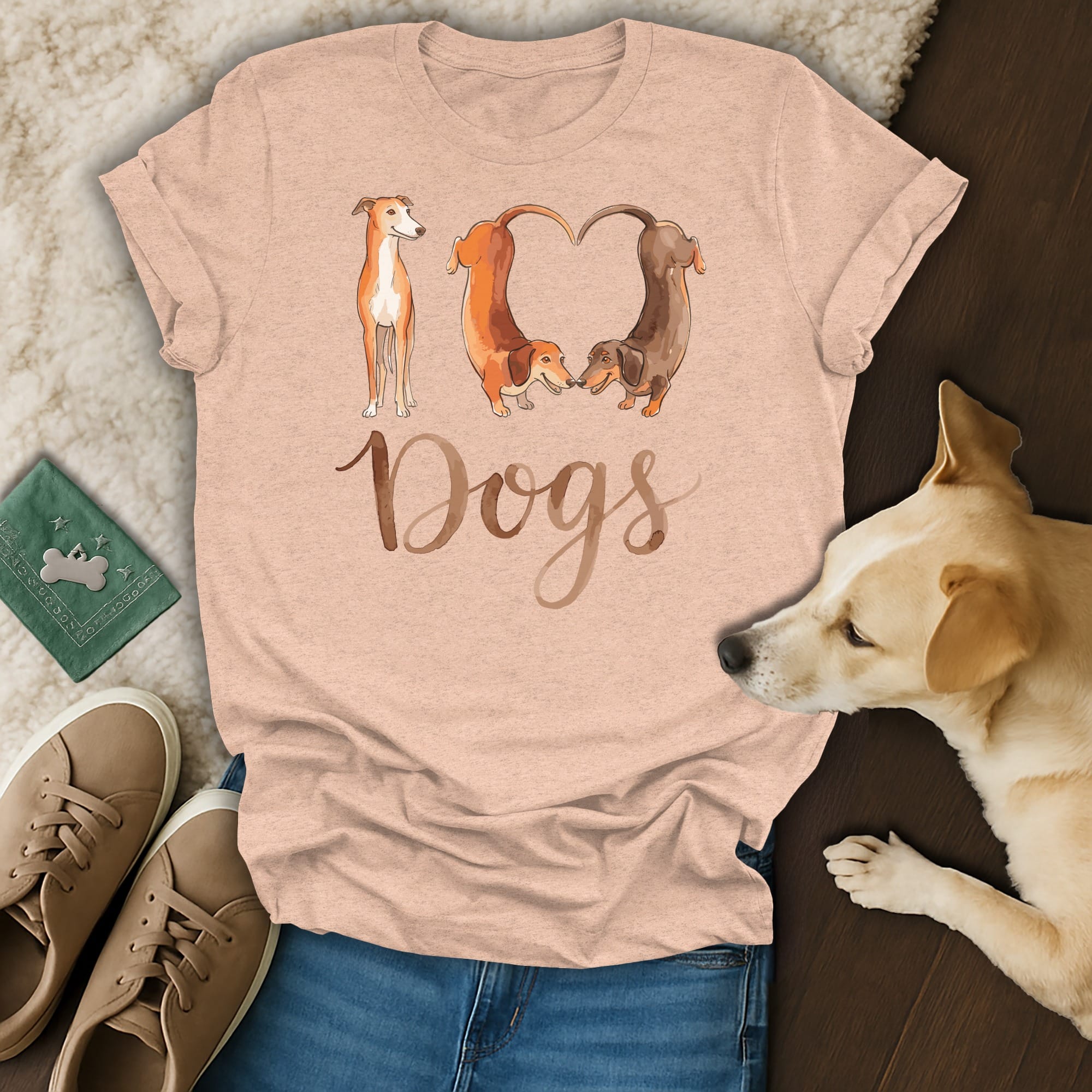 Light peach t-shirt with watercolor dogs forming a heart and the word "Dogs".