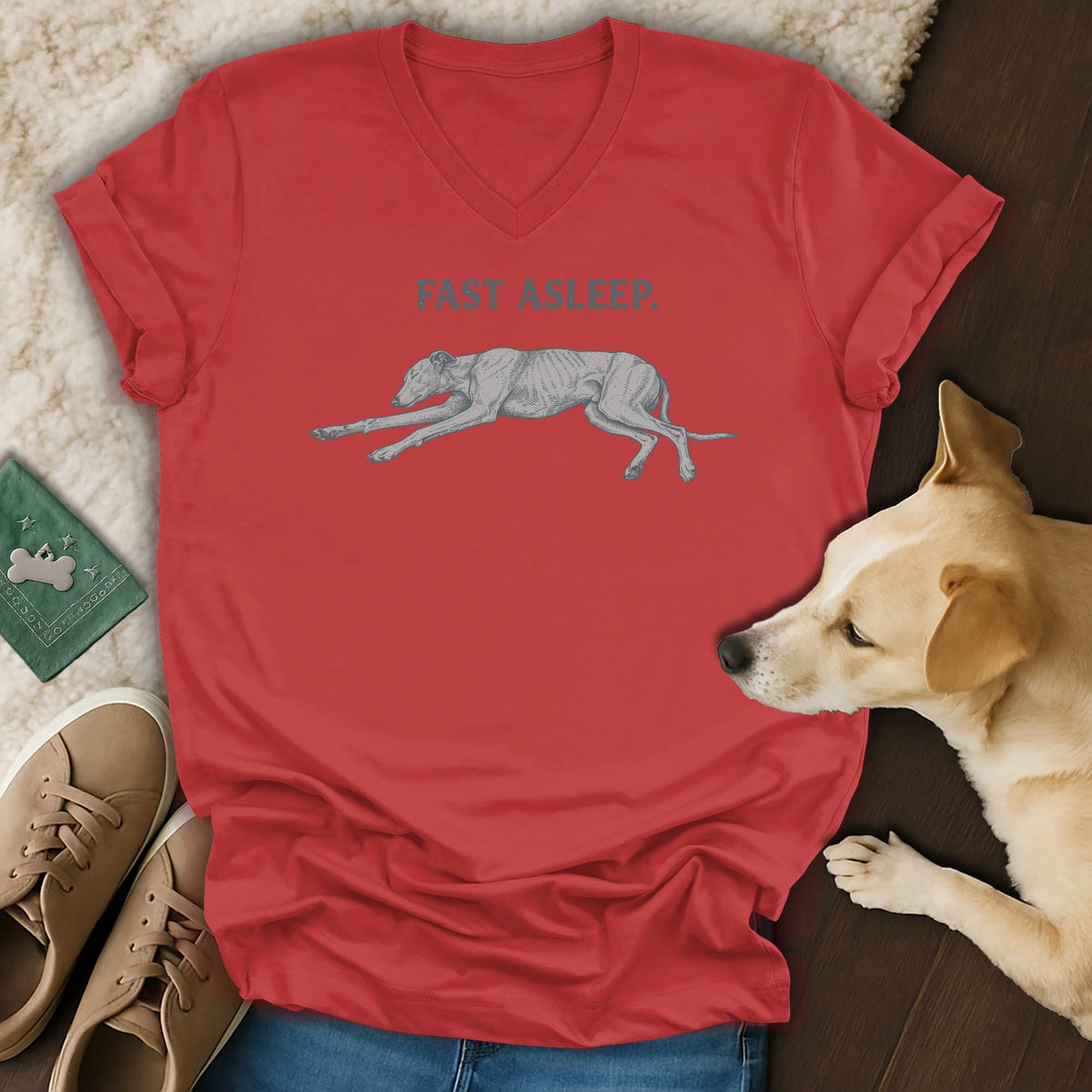 Red v-neck t-shirt with grey dog illustration and text "FAST ASLEEP."