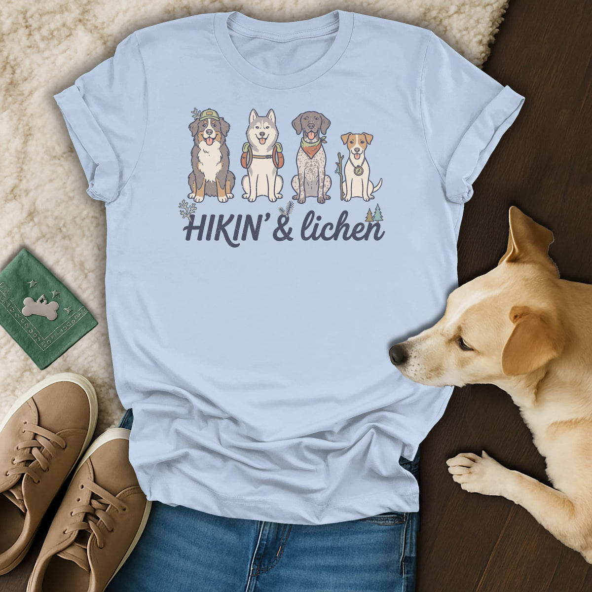 Light blue t-shirt with four illustrated dogs and "HIKIN' & lichen" text.