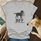 Grey v-neck t-shirt with a graphic of a dog carrying toys and the text "BFF BEST FETCH FRIEND".