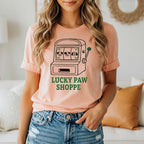 Peach t-shirt with slot machine graphic and "Lucky Paw Shoppe" text.