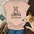 Peach t-shirt with a corgi and pumpkins illustration and text "Feelin' Gourd-geous".