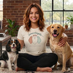 Woman wearing a t-shirt with "Some Angels Have Floppy Ears" and holding two dogs.