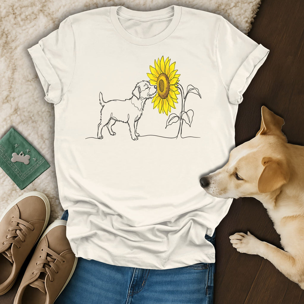 Line drawing of a dog and sunflower on a white t-shirt.
