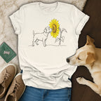 Line drawing of a dog and sunflower on a white t-shirt.