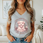 "You Have Rules, I Have Puppy Eyes" text with a dog holding a shoe, surrounded by flowers.