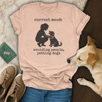 Peach t-shirt with "current mood: avoiding people, petting dogs" and silhouette of person petting dog.