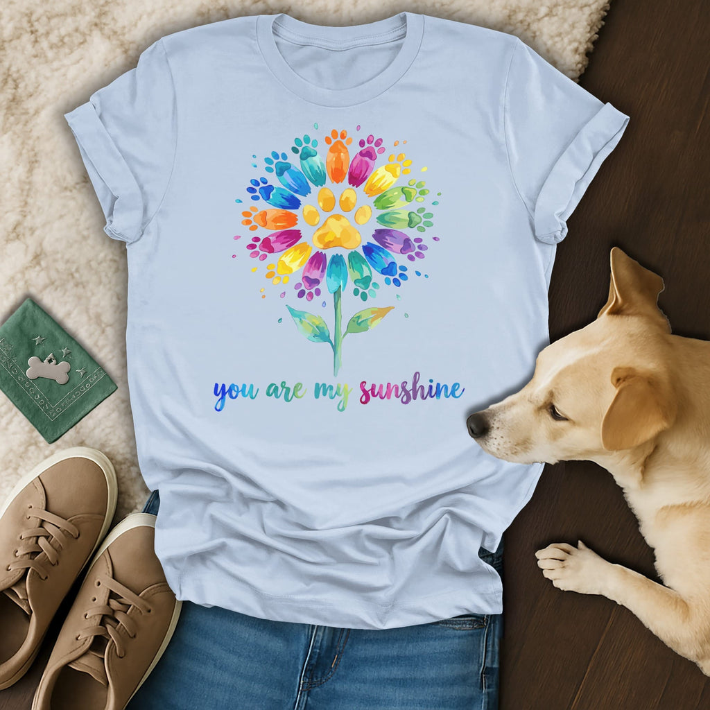 T-shirt with a colorful paw print flower and "you are my sunshine" text.