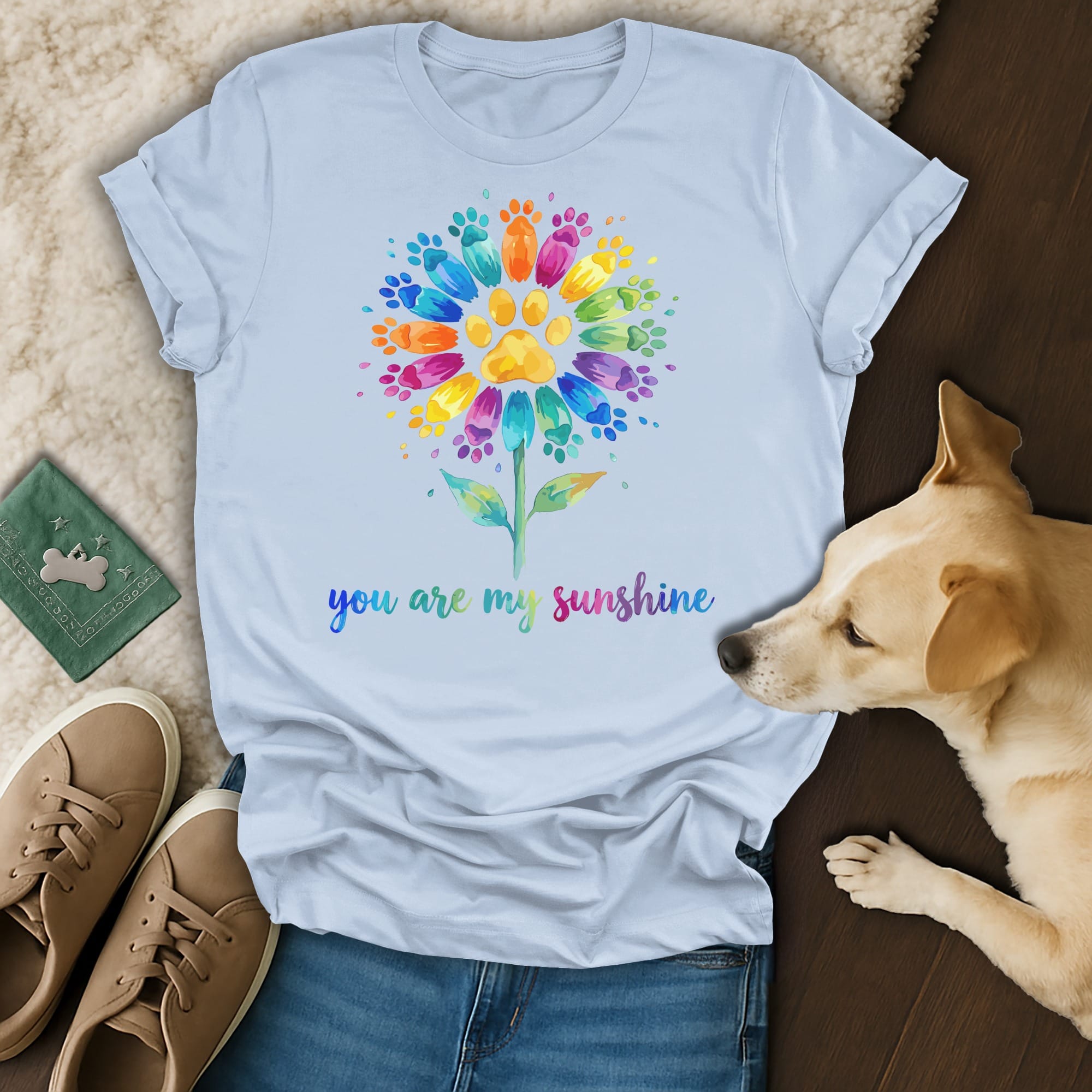 T-shirt with a colorful paw print flower and "you are my sunshine" text.