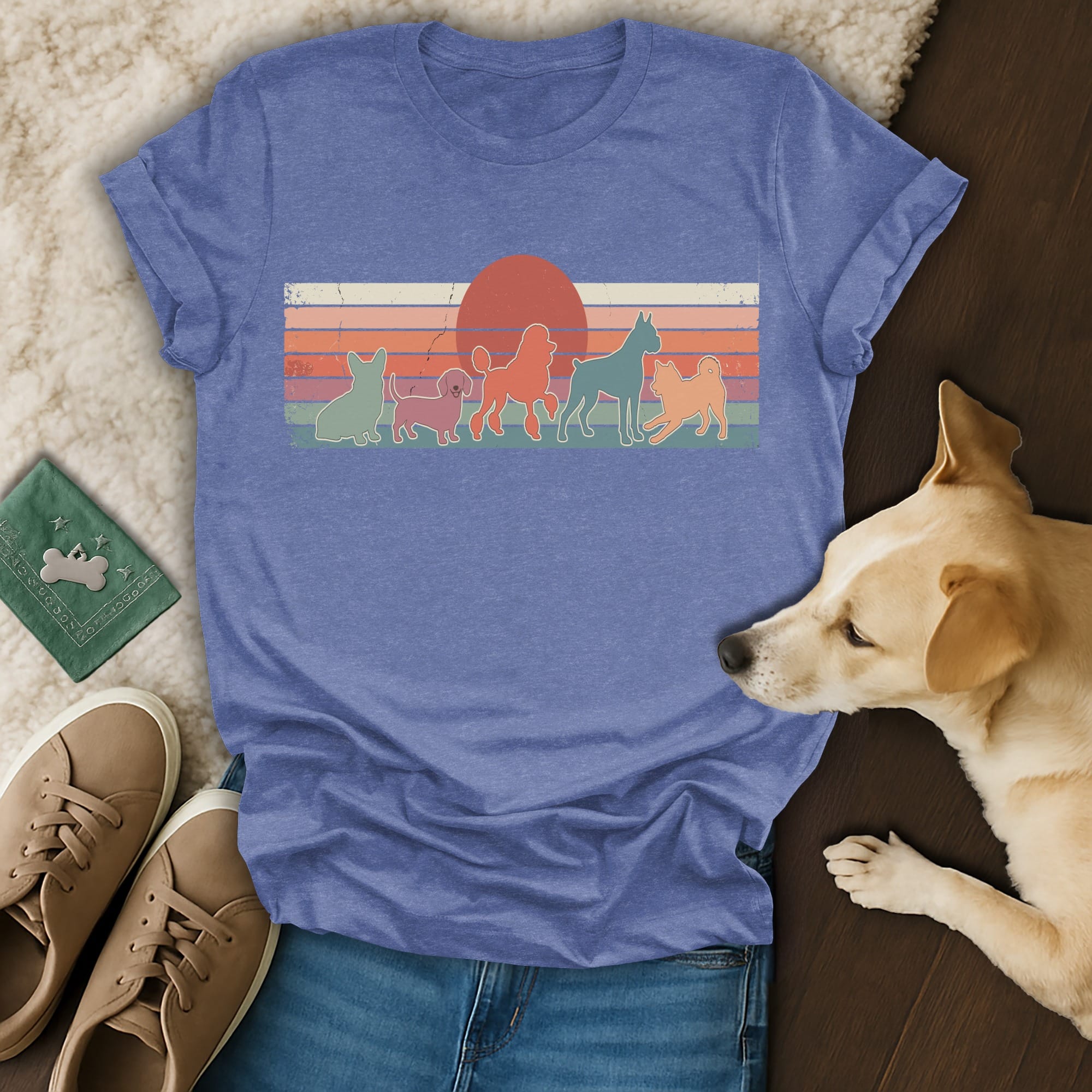 Retro t-shirt with silhouettes of five dogs and a sunset design.