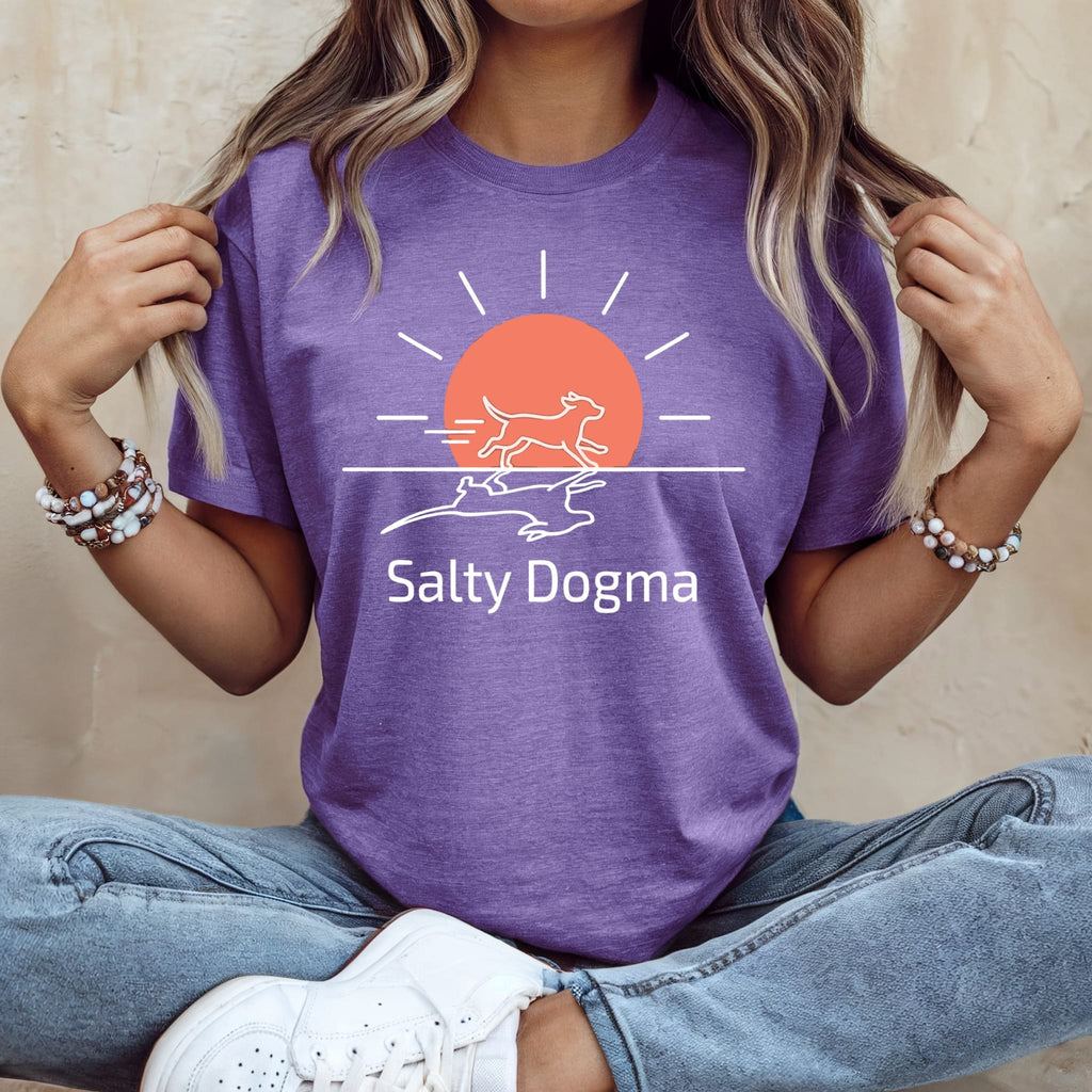 Purple t-shirt with a white line drawing of a dog running towards a sun.
