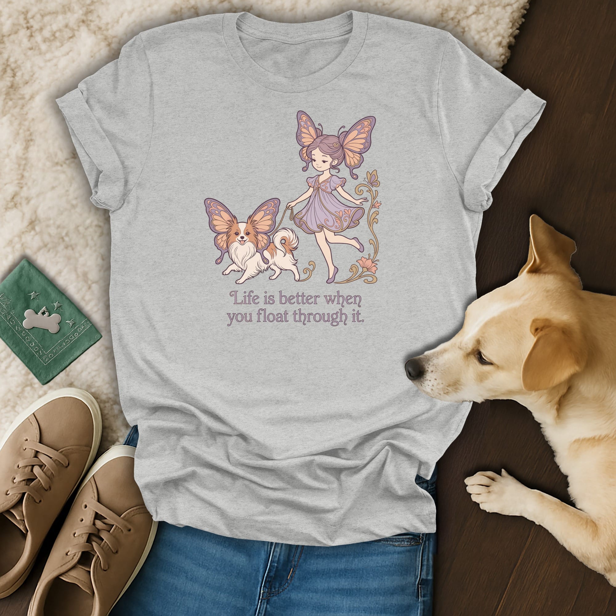 T-shirt with a fairy and a dog, saying "Life is better when you float through it."
