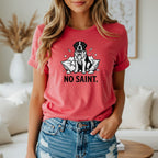 Black and white Saint Bernard dog graphic with text "NO SAINT." on a pink t-shirt.