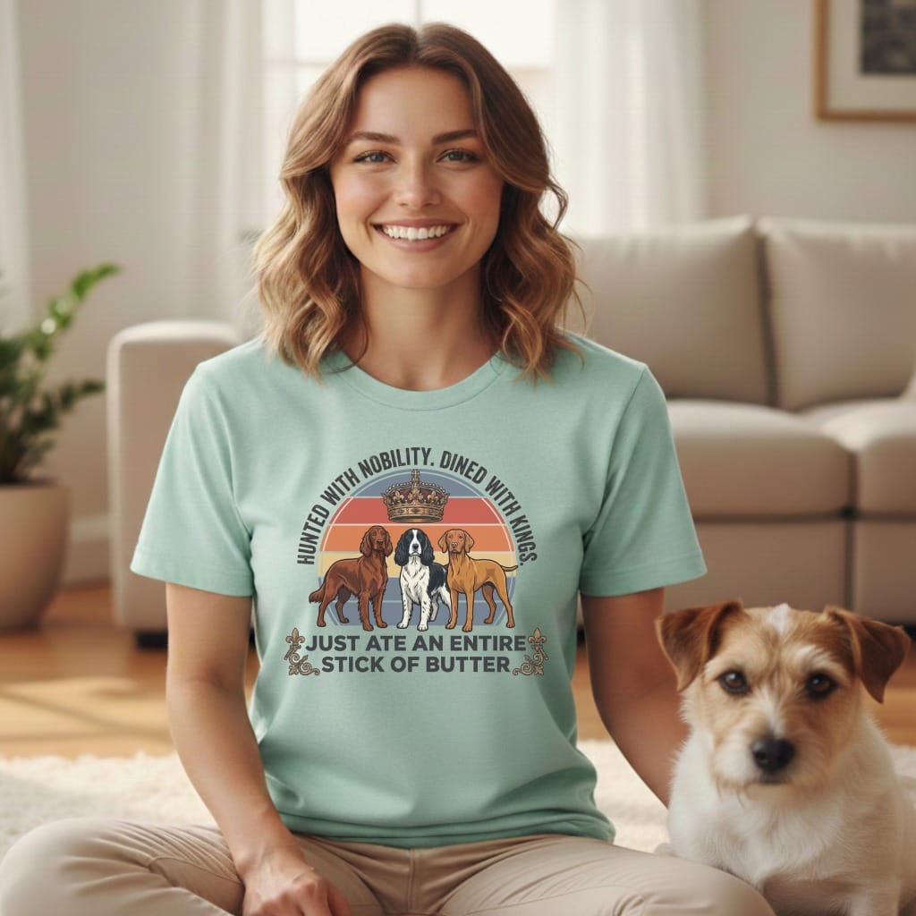 Mint t-shirt with dogs, crowns, and text about nobility and kings.