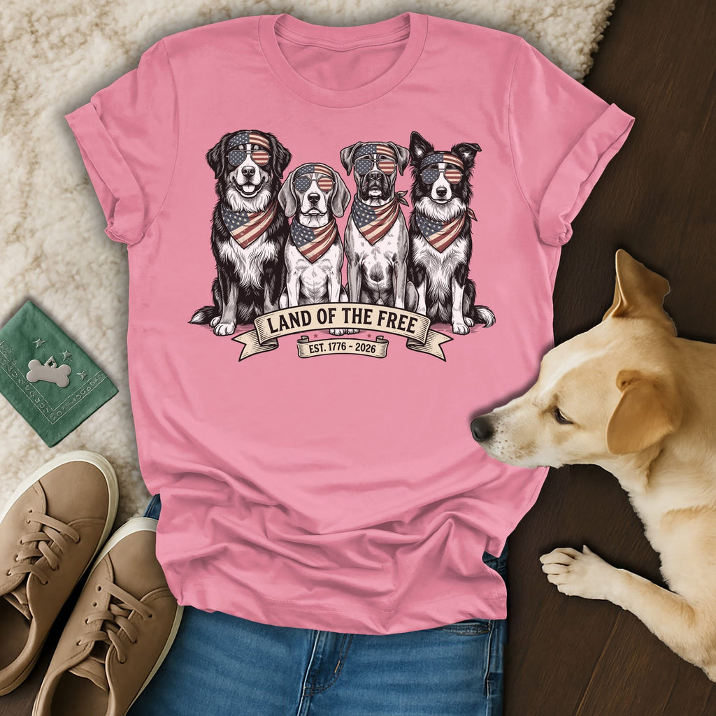 Four dogs in bandanas and sunglasses sitting on a ribbon that says "Land of the Free".