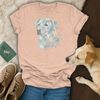 Peach t-shirt with mosaic dog and floral design, laid flat.