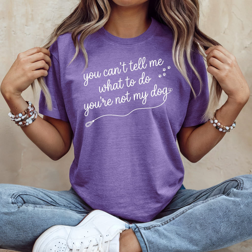 Purple t-shirt with white text "you can't tell me what to do you're not my dog".