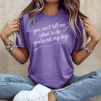 Purple t-shirt with white text "you can't tell me what to do you're not my dog".