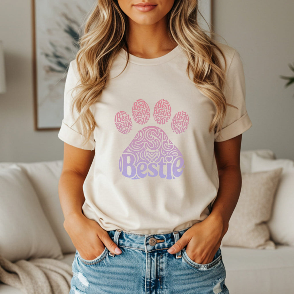 Cream t-shirt with a paw print design and "Bestie" text.