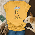 Yellow t-shirt with a line drawing of a happy dog in the rain, with a rainbow.