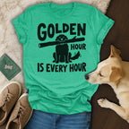 Green t-shirt with black text "GOLDEN HOUR IS EVERY HOUR" and dog graphic.
