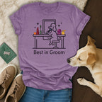 T-shirt with a line drawing of a poodle grooming itself, text "Best in Groom".