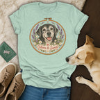Sage green t-shirt featuring an embroidered-style illustration of a dog and the text Silver & Sweet.