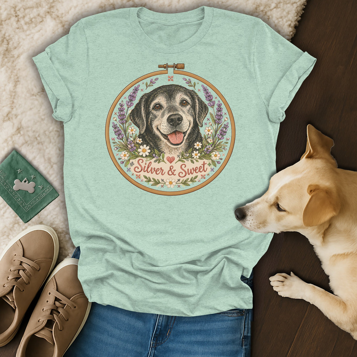 Sage green t-shirt featuring an embroidered-style illustration of a dog and the text Silver & Sweet.