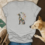 A gray V-neck t-shirt featuring a stained-glass style dog illustration surrounded by flowers.