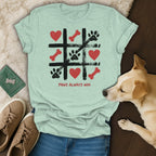 Light green t-shirt with tic-tac-toe game graphic and text "Paws Always Win".