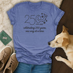 Purple t-shirt with text "250 celebrating 250 years, one wag at a time".