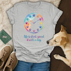 T-shirt with watercolor clock of paw prints, and text "life is short, spend it with a dog."