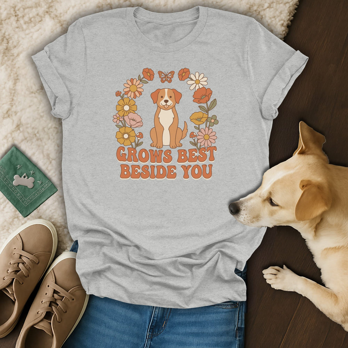 Gray t-shirt featuring a cartoon dog, floral arch, and the text "Grows best beside you".
