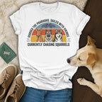 T-shirt with three dogs and text about pharaohs, vikings, and squirrels.