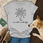 Grey t-shirt with fireworks design, dog silhouette, and text "one nation, under dogs".