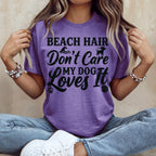 Purple t-shirt with "Beach Hair Don't Care My Dog Loves It" text and dog graphic.