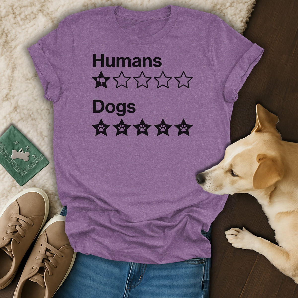 Purple t-shirt with "Humans 1/5 stars, Dogs 5/5 stars" text and paw prints.