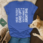Blue t-shirt with white text "Head tilted? Ears up? You'd make a great dog."