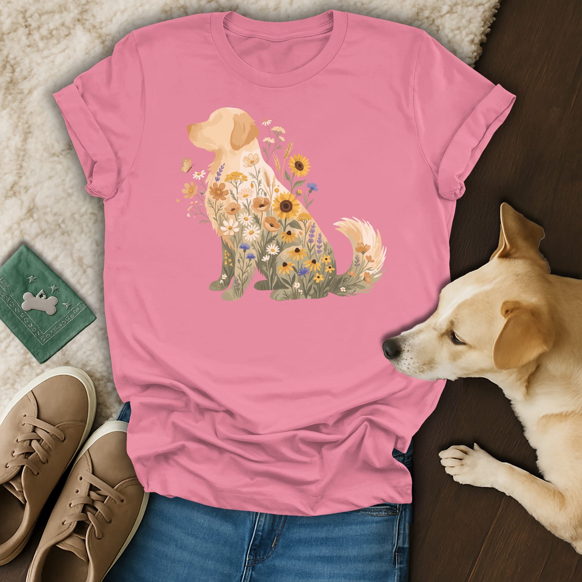 Pink t-shirt with a golden retriever profile filled with various colorful flowers.