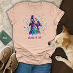 Peach t-shirt with colorful dog head graphic and "shake it off" text.
