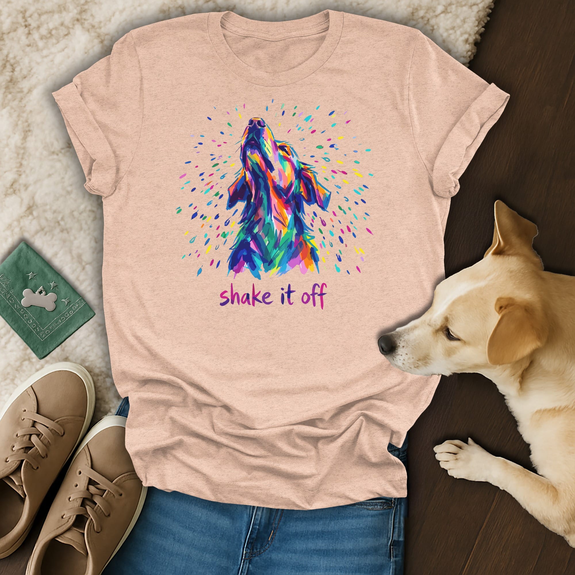 Peach t-shirt with colorful dog head graphic and "shake it off" text.