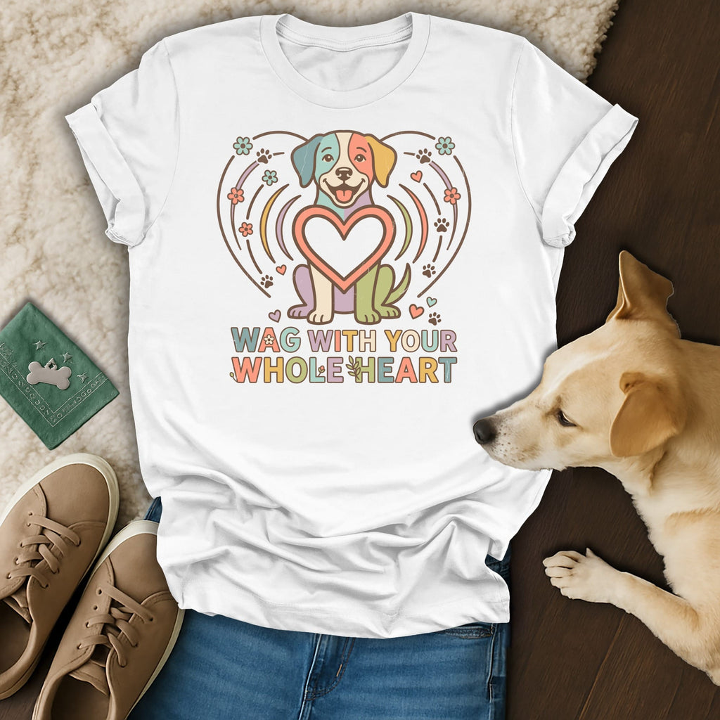 White t-shirt with colorful dog design and text "WAG WITH YOUR WHOLE HEART".