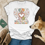 White t-shirt with colorful dog design and text "WAG WITH YOUR WHOLE HEART".