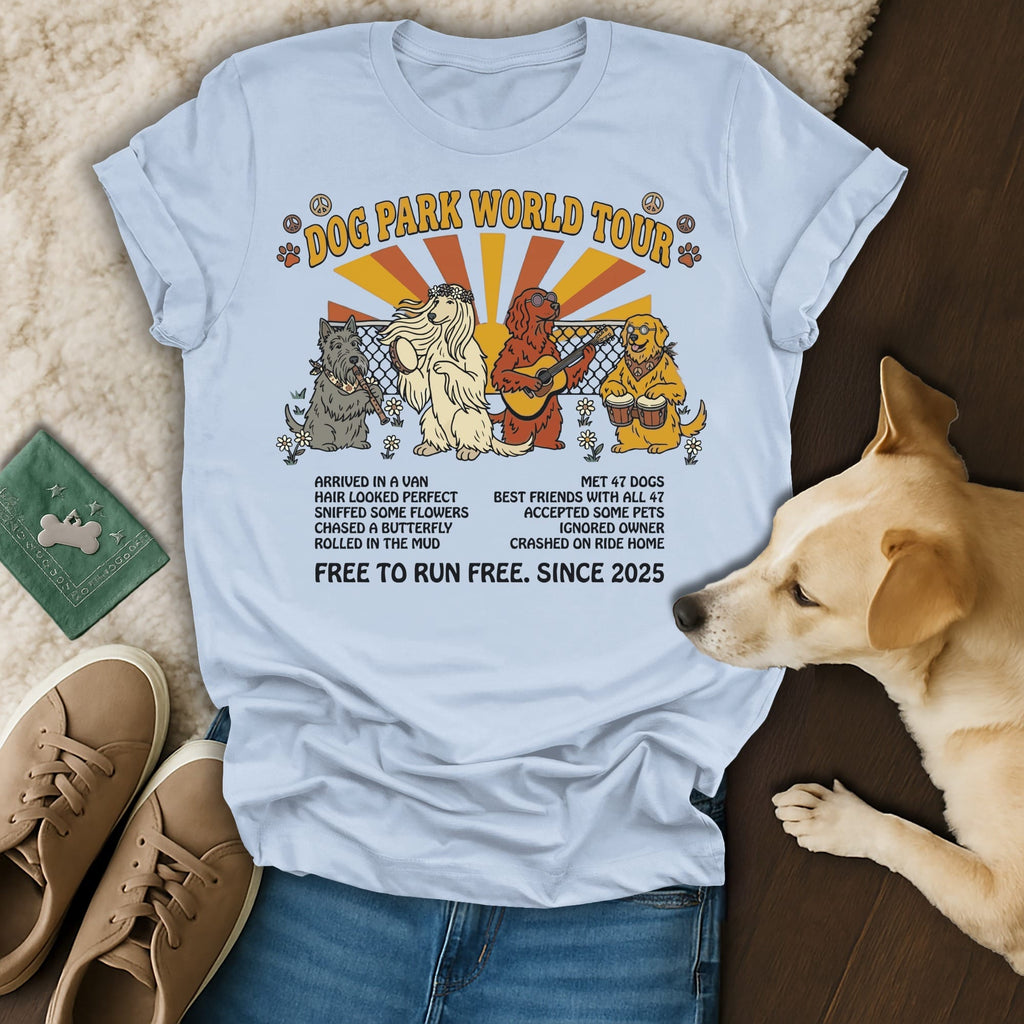 Light blue t-shirt with dogs on a "Dog Park World Tour" graphic.