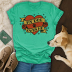 Teal t-shirt with "My Dog Owns Me" text inside a heart and rose design.